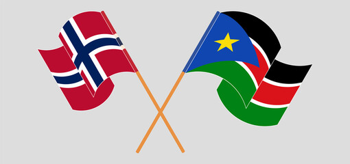 Crossed and waving flags of Norway and South Sudan