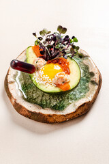 ..Homemade Organic Egg Baked in Avocado with Salt and Peppe