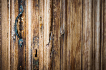 Fototapeta na wymiar Old door with ancient handle inside the Sé cathedral in Porto