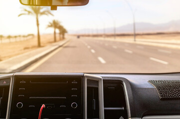 View of the highway through the windshield of a car
