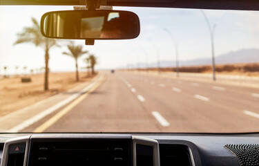 View of the highway through the windshield of a car
