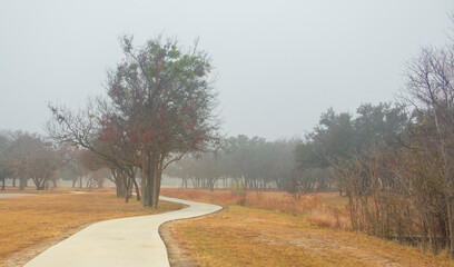 Brownwood Texas walking trail festival park, during foggy mourning, relaxing panorama view, recreation area.