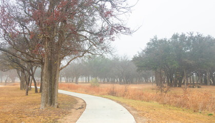 Brownwood Texas walking trail festival park, during foggy mourning, relaxing panorama view, recreation area.