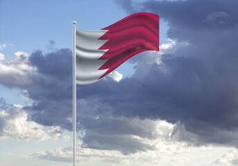 Flag of the Bahrain on a stick, dark clouds in the background