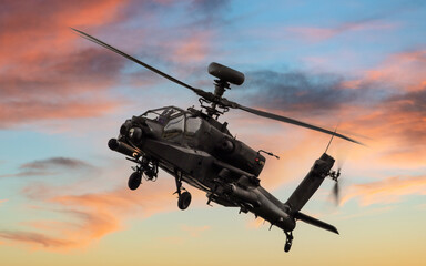 Apache attack helicopter at sunset