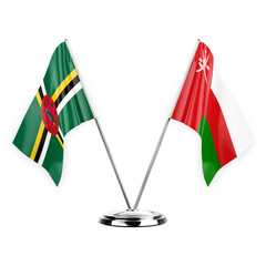 Two table flags isolated on white background 3d illustration, dominica and oman