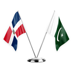 Two table flags isolated on white background 3d illustration, dominican republic and pakistan