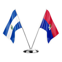 Two table flags isolated on white background 3d illustration, el salvador and haiti