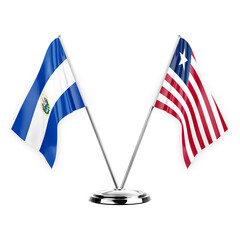 Two table flags isolated on white background 3d illustration, el salvador and liberia