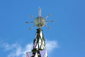 decorated Christmas tree on the background of blue sky