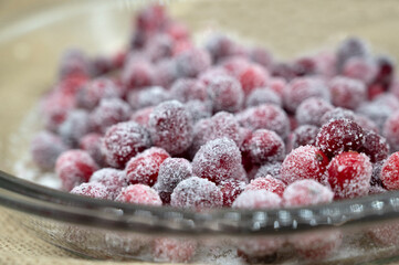  Cranberries covered with white sugar. Candied cranberry with sugar.