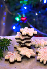 Holiday chocolate bark with dark and white chocolate on Christmas festive background. 