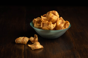 chipss in a bowl on a wooden table