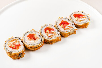 Teriyaki sushi roll isolated on white background.