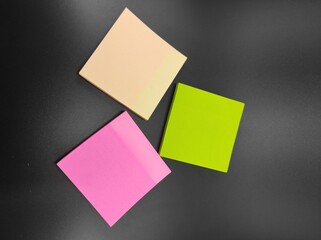 Photo of multicolored paper notes isolated on black background, Not Focus