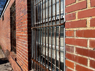 Old creepy scary abandoned building bars on wondow