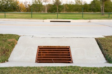 The Steel grate cover to drain water after rain. Protect flood. Streams flow into a hole , tool for the flow of water.