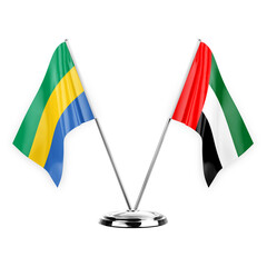 Two table flags isolated on white background 3d illustration, gabon and united arab emirates