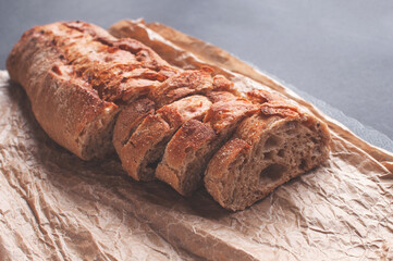 cereal baguette cut into pieces on parchment paper