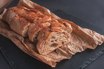 cereal baguette cut into pieces on parchment paper