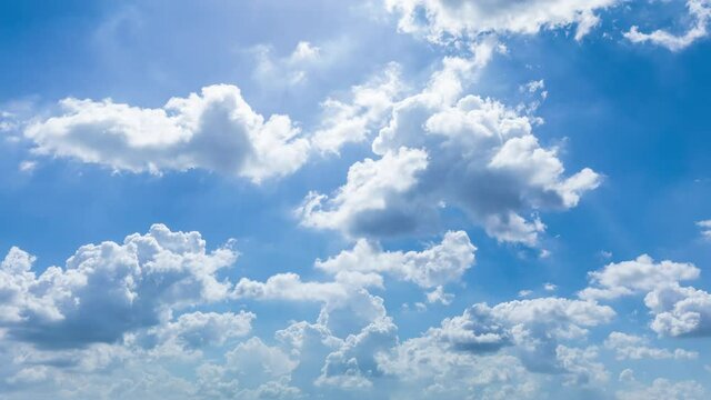 Blue sky white clouds landscape. Puffy fluffy white clouds. Cloud time lapse nature background.