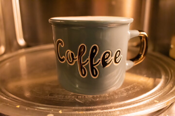 Coffee cup in microwave