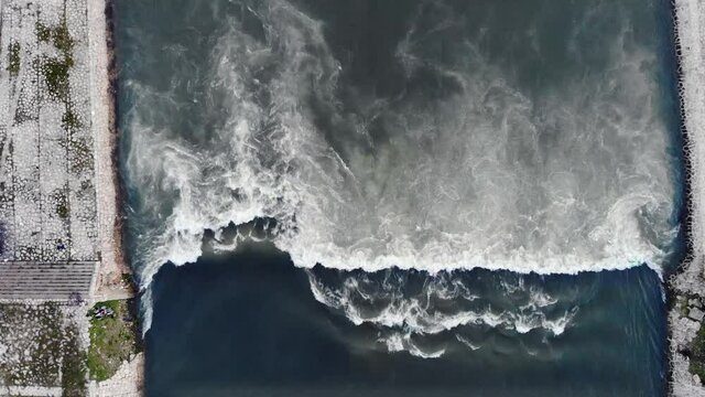 Approaching Vardar river height drop, top-down view of water flowing turbulently