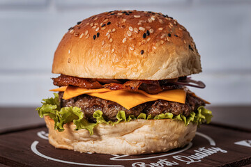 Bolvina burger with cheddar bacon and lettuce