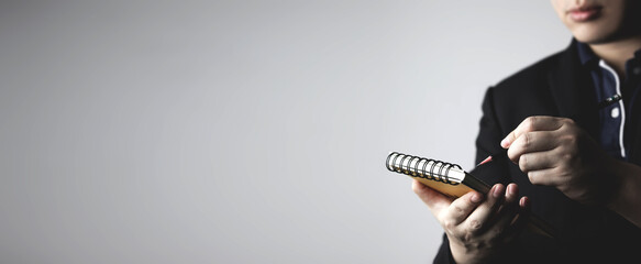 man write notes in notebook. concept of event planning creativity appointment record Write down...