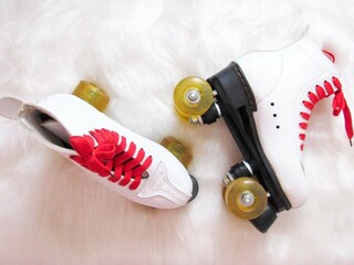 white and red rollerblades