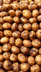 Fresh young potatoes as texture background, potatoes on the food market