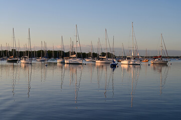Fototapeta na wymiar Moored sailboats off Coconut Grove in predawn light on December 27, 2021.