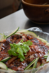 Close up of Hainan roasted chicken slices. Chinese cuisine takeaway food. 