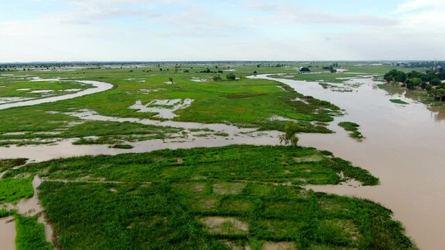 The flooded Argungu river and tributaries that flow through Nigeria's Kebbi State - sweeping panoramic aerial view