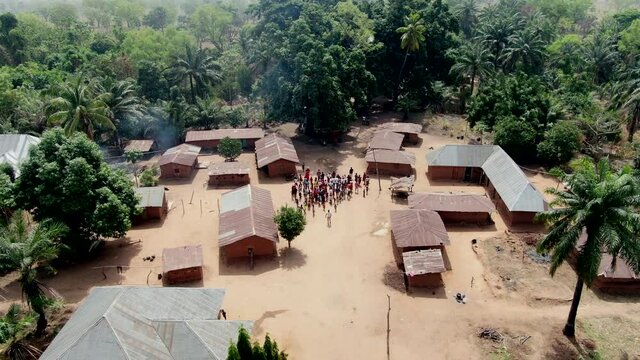Residents of a small village community, Olegobidu, Nigeria, disburse after gathering for a drone video