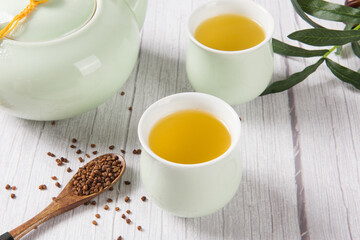 buckwheat tea in cup on  wood background.