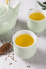 buckwheat tea in cup on  wood background.