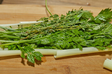 Chef prepares bouquet of herbs and herbs in the kitchen for dressing the dish