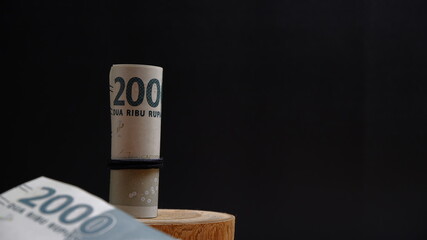 Rupiah the official currency of Indonesia. Business and finance concept. Uang 2000 Rupiah. Bank...