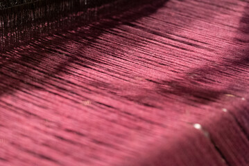 close up of an old traditional scottish weaving loom for weaving Harris Tweed - Gearrannan...