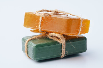 Natural soap bars tied with ribbon isolated on white