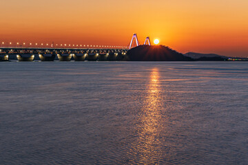 Sunset on the beach overlooking the bridge
