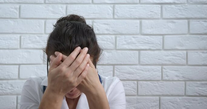 Overworked doctor in cabinet. An overworked doctor stay an feel stress in the cabinet.