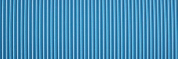 Closeup of blue striped perforated paper background