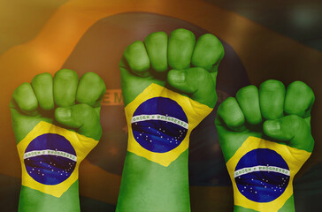 The Brazilian flag is drawn on a clenched fist and in the background.