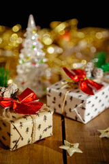 Christmas New Year's boxes with gifts. Yellow garland and decorative stars