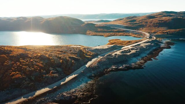 Arctic aerial. Aerial view of the Barents Sea coastline with road and beach. Arctic Tundra near the town of Teriberka in Russia