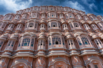 Hawa Mahal, pink palace of winds in old city Jaipur, Rajasthan, India. Background of indian...