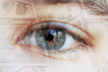 Close-up human eye with dollars in the pupil. Concept - money in the eyes.