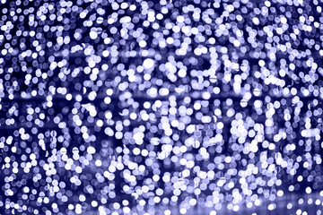 Bokeh in the color of 2022. Abstract background with lights.